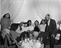 Image of Party-goers sitting on a couch, Seattle, circa 1945