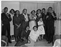 Image of Partygoers posing inside home, Seattle, circa 1950