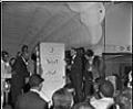Image of Crowd watching presenters on stage at the Trianon, Seattle, April 9, 1950
