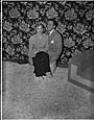 Image of Italian club president and wife seated on stool, Seattle, circa 1950