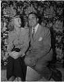 Image of Italian club president and wife seated on stool, Seattle, circa 1950