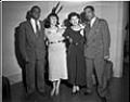 Image of Two couples posing in living room, Seattle, circa 1953