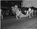 Image of Chinese dancers performing in a parade, Seattle, circa 1953