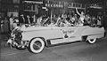 Image of Festival queen waving from car during parade, Seattle, circa 1950