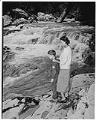 Image of Izzy and Butch Smith standing on rocks, Granite Falls, circa 1953