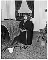 Image of Woman posing near piano, Seattle, circa 1953