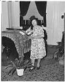 Image of NACWC convention delegate posing near piano, Seattle, August 1948
