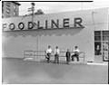 Image of Kimura family posing in front of their store, Seattle, circa 1953