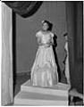 Image of Lillian Gideon modeling gown at fashion show, Seattle, circa 1953