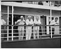 Image of Men standing at the rail of a ship, Seattle, circa 1953