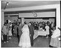 Image of Rev. McKinney speaking with newlyweds at wedding reception, Seattle, 1959