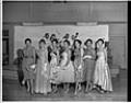 Image of Seven women standing in front of stage, Seattle, circa 1953