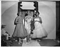 Image of Three women modeling dresses at fashion show, Seattle, circa 1953