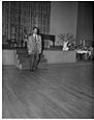 Image of Man modeling leopard print jacket at fashion show, Seattle, circa 1953