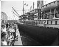Image of Ship pulling away from pier, Seattle, circa 1953