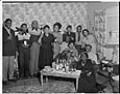 Image of Party group posing with raised glasses, Seattle, circa 1953