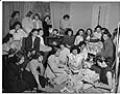 Image of Miss Kimura opening gifts at wedding shower, Seattle, circa 1953