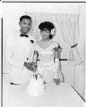Image of Johnny Moten and his bride cutting their wedding cake, Seattle, circa 1949