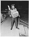 Image of Freddie Brown tossing newspaper, Seattle, 1949