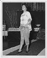 Image of Woman modeling outfit at fashion show, circa 1955