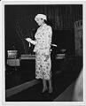 Image of Woman modeling outfit at fashion show, circa 1955