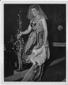 Image of Woman modeling dress at fashion show, circa 1955