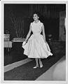 Image of Woman modeling dress at fashion show, circa 1955