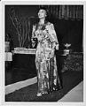 Image of Woman modeling robe at fashion show, circa 1955