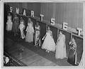 Image of Woman modeling dress at fashion show, circa 1955
