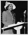 Image of Ola Browning speaking at fashion show, Seattle, circa 1953