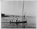 Image of Three young men on a sailboat, Seattle, circa 1956