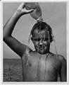 Image of Boy pouring water over his head, Seattle, circa 1953