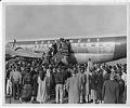 Image of Northwest Airlines plane with passengers on the boarding ramp, Seattle, circa 1950
