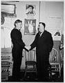 Image of Two men shaking hands, circa 1944