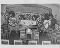 Image of Casket and flowers in a funeral parlor, Seattle, circa 1956