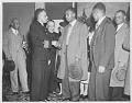 Image of Church members congratulating man in Navy uniform, Seattle, October 14, 1944