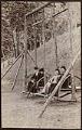 Image of Two couples on gliders at Madrona Park, Seattle, circa 1895