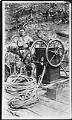 Image of Henry Finch posing with diving equipment, Seattle, January 1924