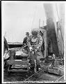 Image of Diver holding a water main joint, Seattle, January 29, 1924