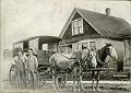 Image of Woodland Dairy employees and delivery cart, Seattle, circa 1912