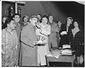 Image of Woman feeding cake to serviceman, Seattle, December 1941