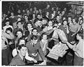 Image of Women and servicemen eating sandwiches at USO club, Seattle, February 1942
