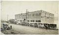 Image of Washington Laundry building and delivery carriages, Seattle, 1910