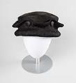 Image of Black straw hat made by Izzie Lewis, ca. 1996