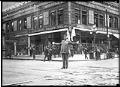 Image of Police officer directing traffic at 4th and Pike, Seattle, circa 1920