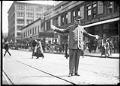 Image of Police officer directing traffic at 4th and Pike, Seattle, circa 1920