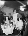 Image of Woman serving dessert to international students, November 1962