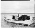 Image of Marya Moses in her fishing boat, July 5, 1962