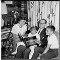 Image of Suzie Ordogh reading with her guardian family, Seattle, September 17, 1959