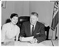Image of Suzie Ordogh and John Boyd with her permanent residency papers, Seattle, December 24, 1958